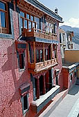 Ladakh - Tikse gompa, the main monastery halls with the characteristc red painted windows and woden balconies 